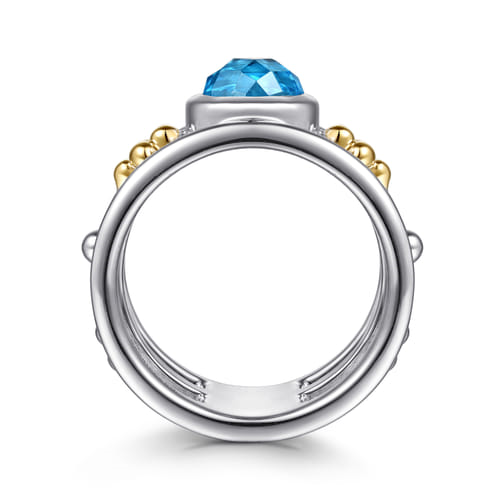 14 KARAT YELLOW GOLD AND STERLING SILVER BUJUKAN BLUE TOPAZ WIDE BAND RING