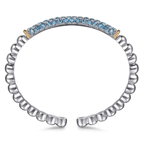 14 KARAT YELLOW GOLD AND STERLING SILVER LONDON BLUE TOPAZ BANGLE BRACELET