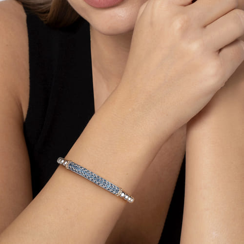 14 KARAT YELLOW GOLD AND STERLING SILVER LONDON BLUE TOPAZ BANGLE BRACELET