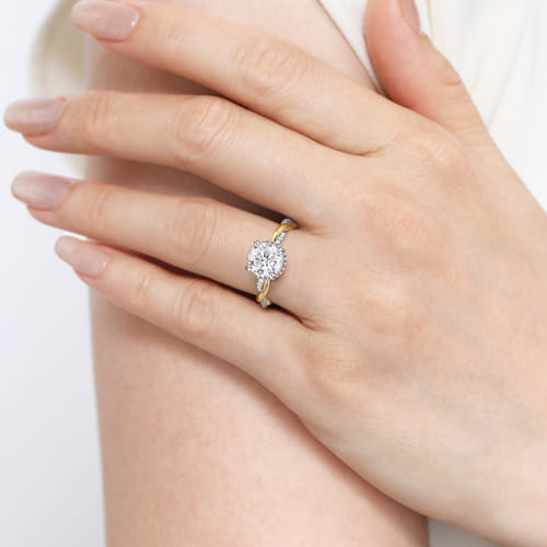 14 KARAT WHITE-YELLOW GOLD TWISTED ROUND HALO DIAMOND ENGAGEMENT RING