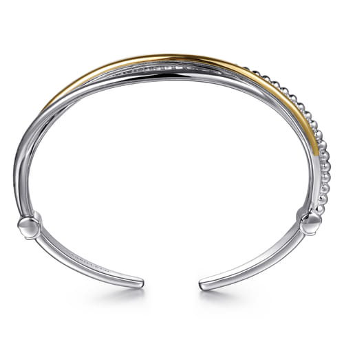 STERLING SILVER AND 14 KARAT YELLOW GOLD BUJUKAN TWISTED BANGLE BRACELET