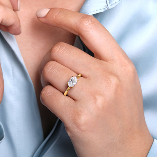 14 KARAT YELLOW GOLD EAST WEST OVAL SOLITAIRE ENGAGEMENT RING