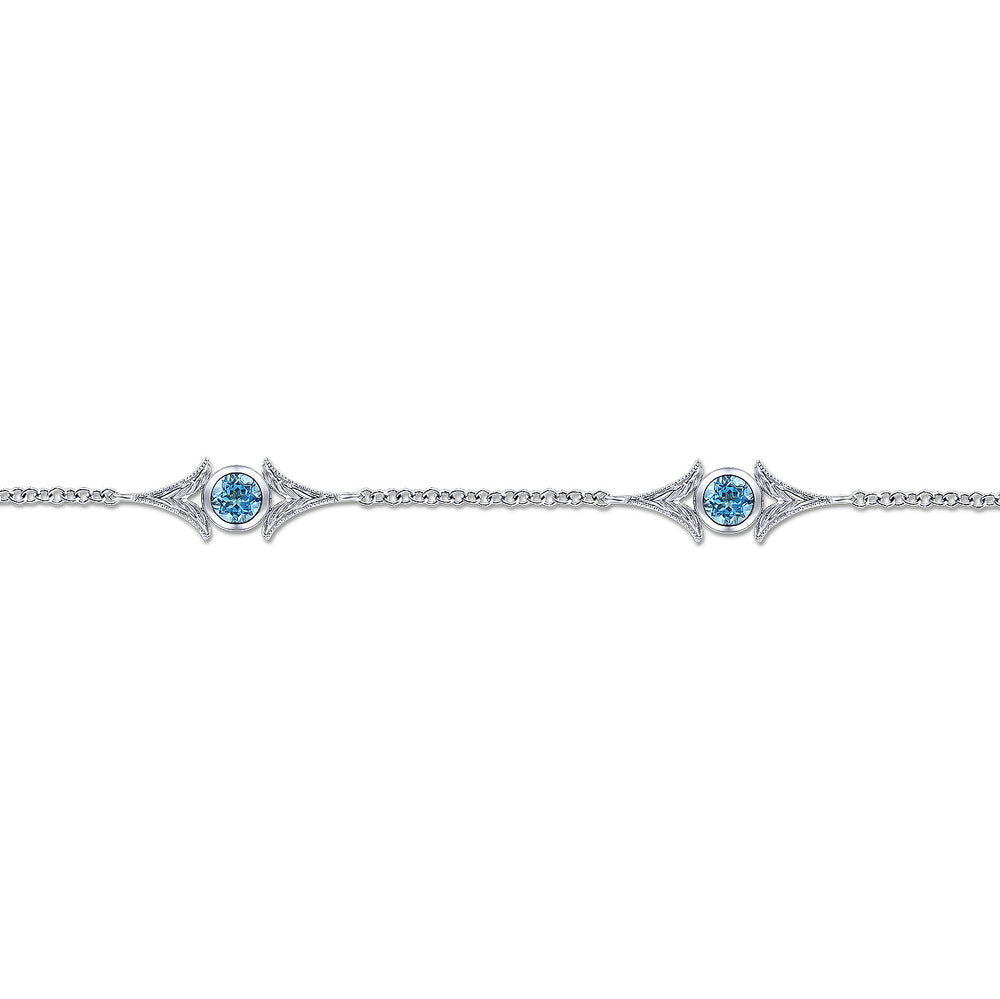 STERLING SILVER SWISS BLUE TOPAZ STATION BRACELET