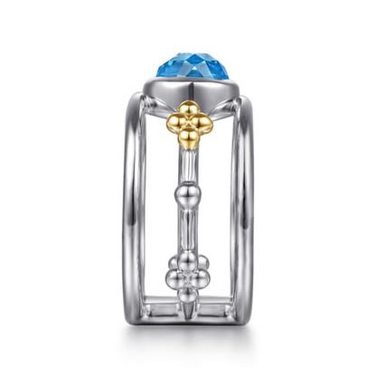 14 KARAT YELLOW GOLD AND STERLING SILVER BUJUKAN BLUE TOPAZ WIDE BAND RING