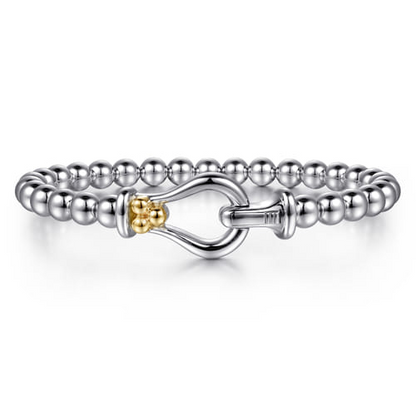 14 KARAT YELLOW GOLD AND STERLING SILVER BUJUKAN HORSE SHOE BANGLE BRACELET
