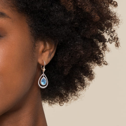 14 KARAT YELLOW GOLD AND STERLING SILVER BUJUKAN PEAR  BLUE TOPAZ LEVERBACK DROP EARRINGS
