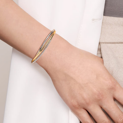 STERLING SILVER AND 14 KARAT YELLOW GOLD BUJUKAN TWISTED BANGLE BRACELET