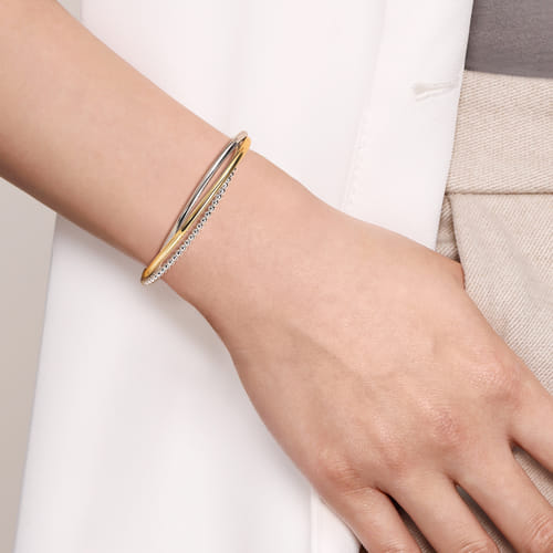 STERLING SILVER AND 14 KARAT YELLOW GOLD BUJUKAN TWISTED BANGLE BRACELET