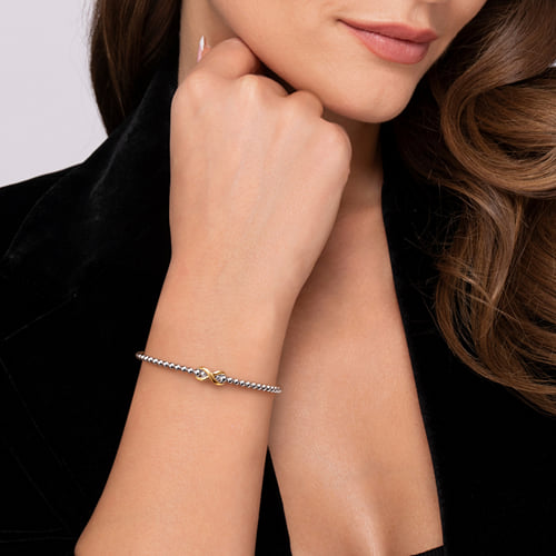 14 KARAT YELLOW GOLD AND STERLING SILVER BUJUKAN INFINITY CUFF