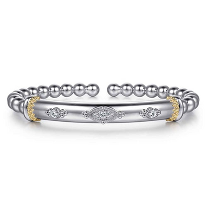 14 KARAT YELLOW GOLD AND STERLING SILVER BUJUKAN WHITE SAPPHIRE SPLIT BANGLE BRACELET