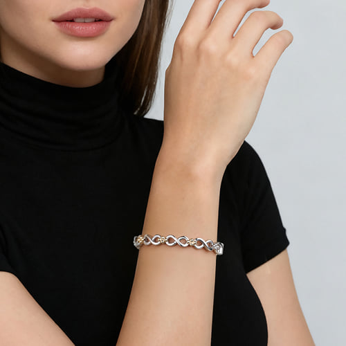 14 KARAT YELLOW GOLD AND STERLING SILVER BUJUKAN INFINITY CUFF BRACELET