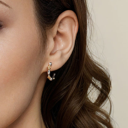 14 KARAT YELLOW GOLD AND STERLING SILVER BUJUKAN TWO TONE J HOOP EARRINGS