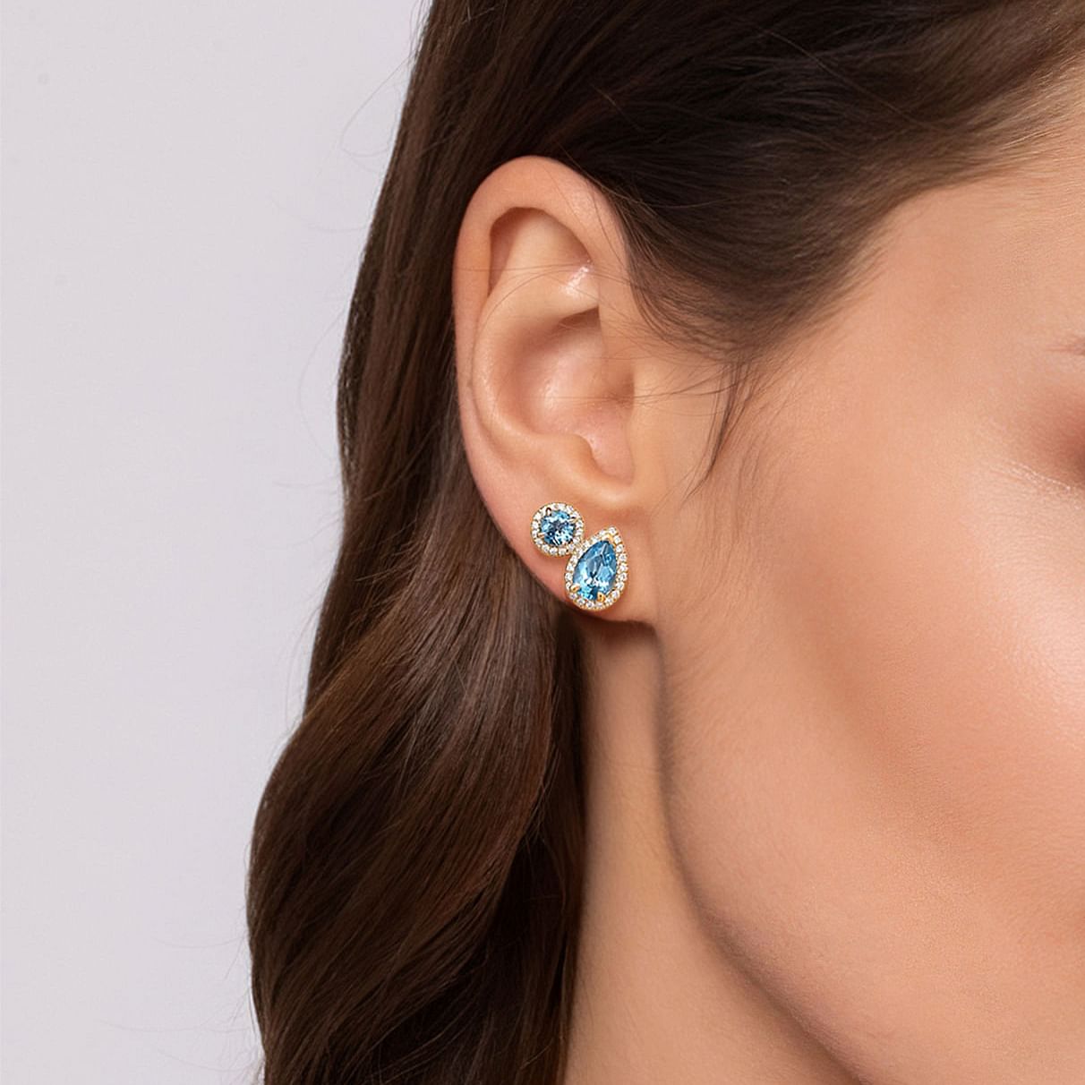 14 KARAT YELLOW GOLD TOI ET MOI BLUE TOPAZ AND DIAMOND HALO STUD EARRINGS
