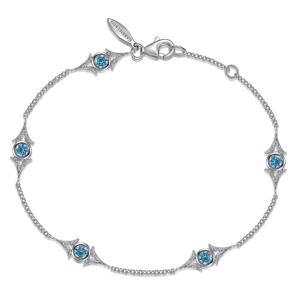 STERLING SILVER SWISS BLUE TOPAZ STATION BRACELET