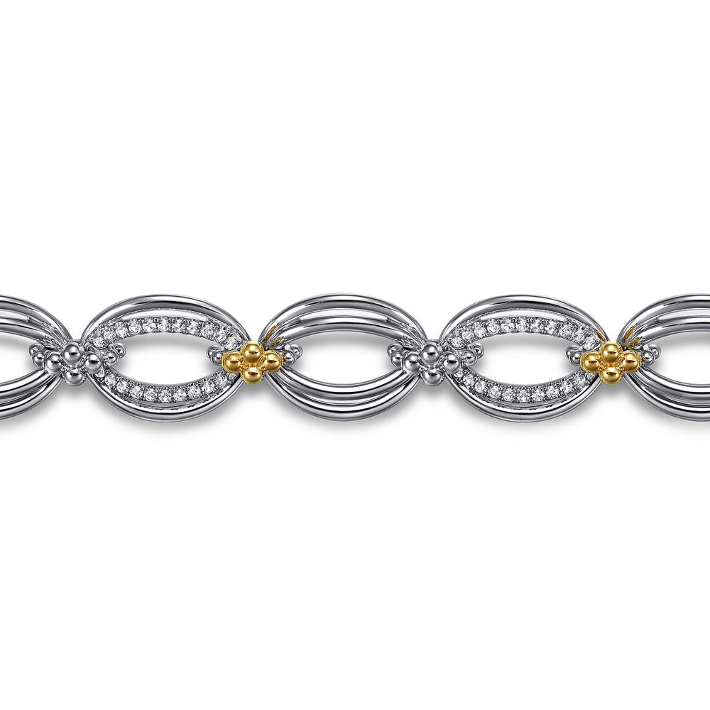 STERLING SILVER AND 14 KARAT YELLOW GOLD BUJUKAN WHITE SAPPHIRE LINK BRACELET