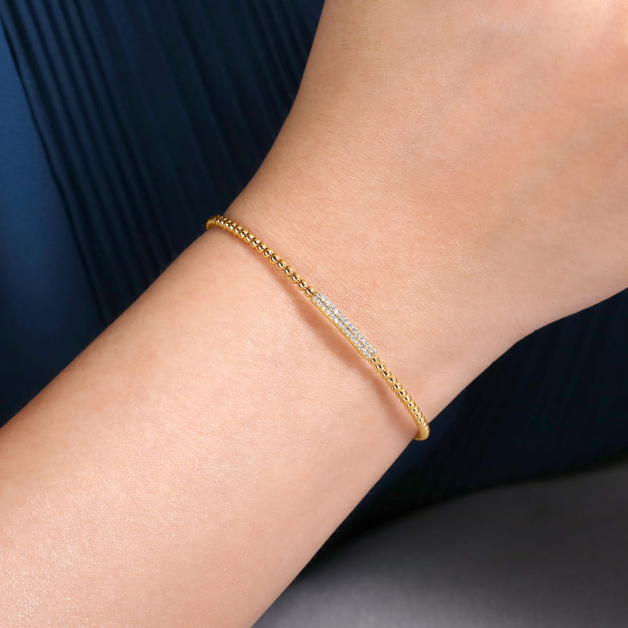 14 KARAT YELLOW GOLD BUJUKAN BEAD BANGLE WITH DIAMONDS